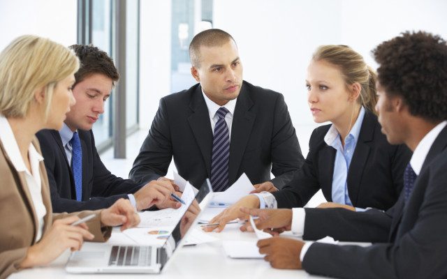 Group Of Business People Having Meeting In Office